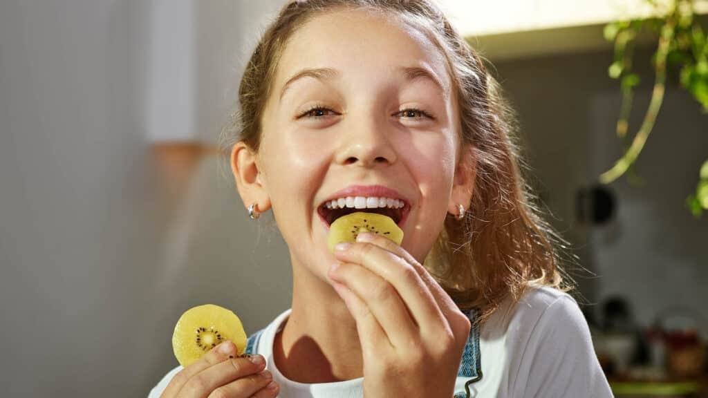 eating golden kiwi